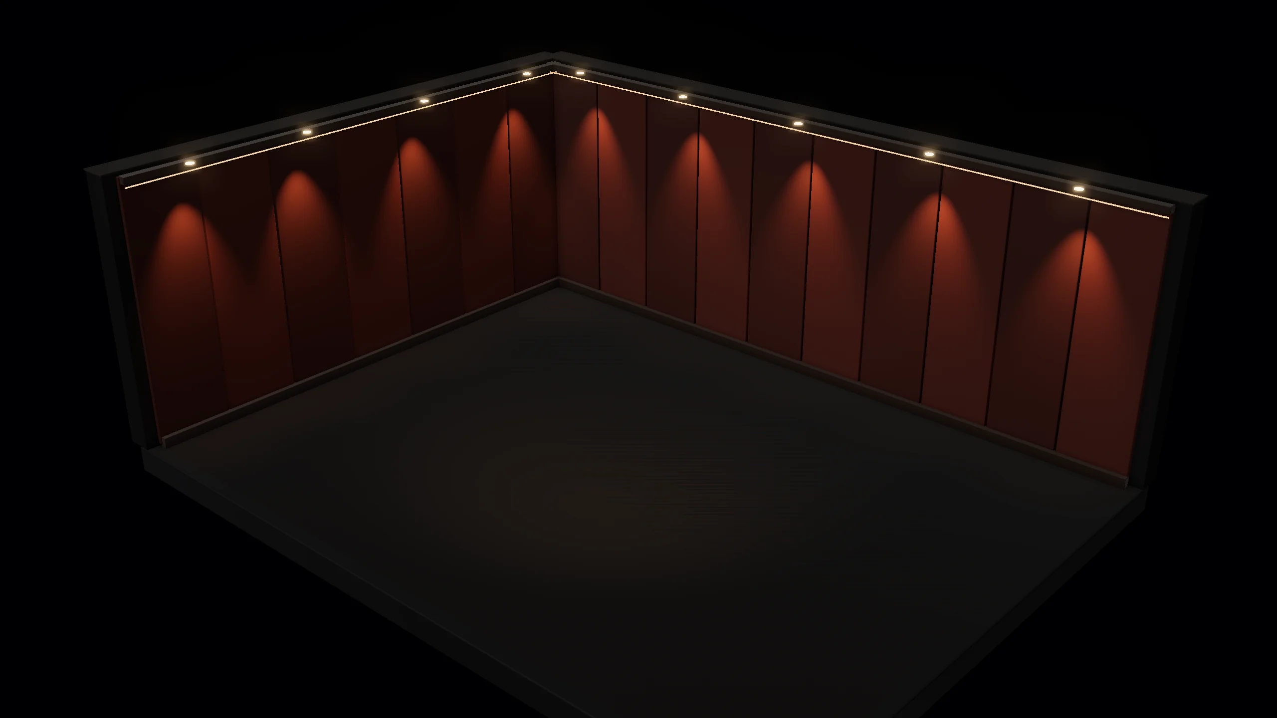 An empty room with warm lights washing down dark red walls